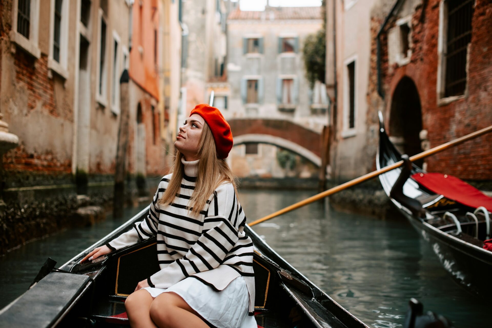 A lady riding a boat in Little Venice