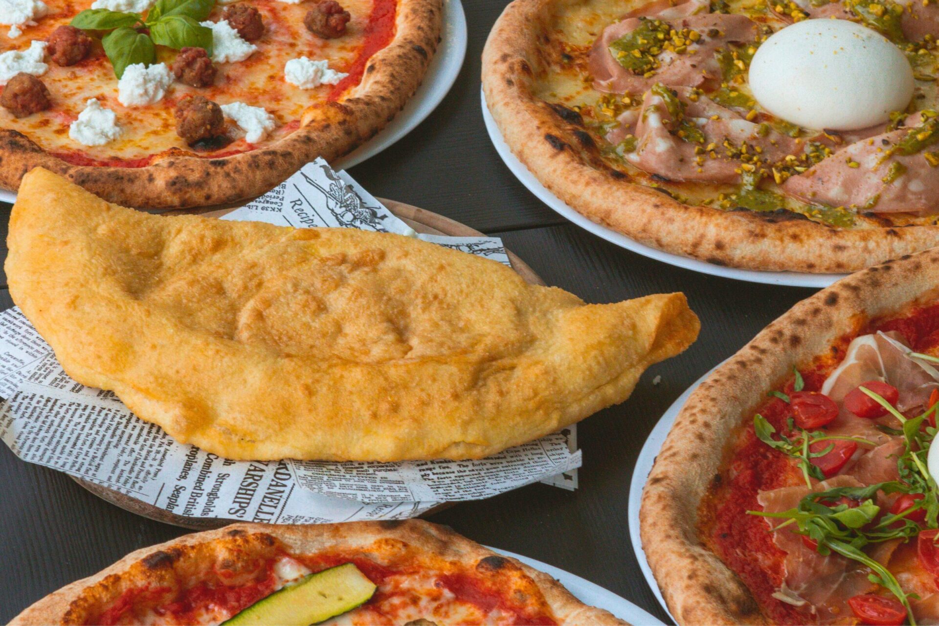 Varieties of pizza on a table. Food scene in Italy.