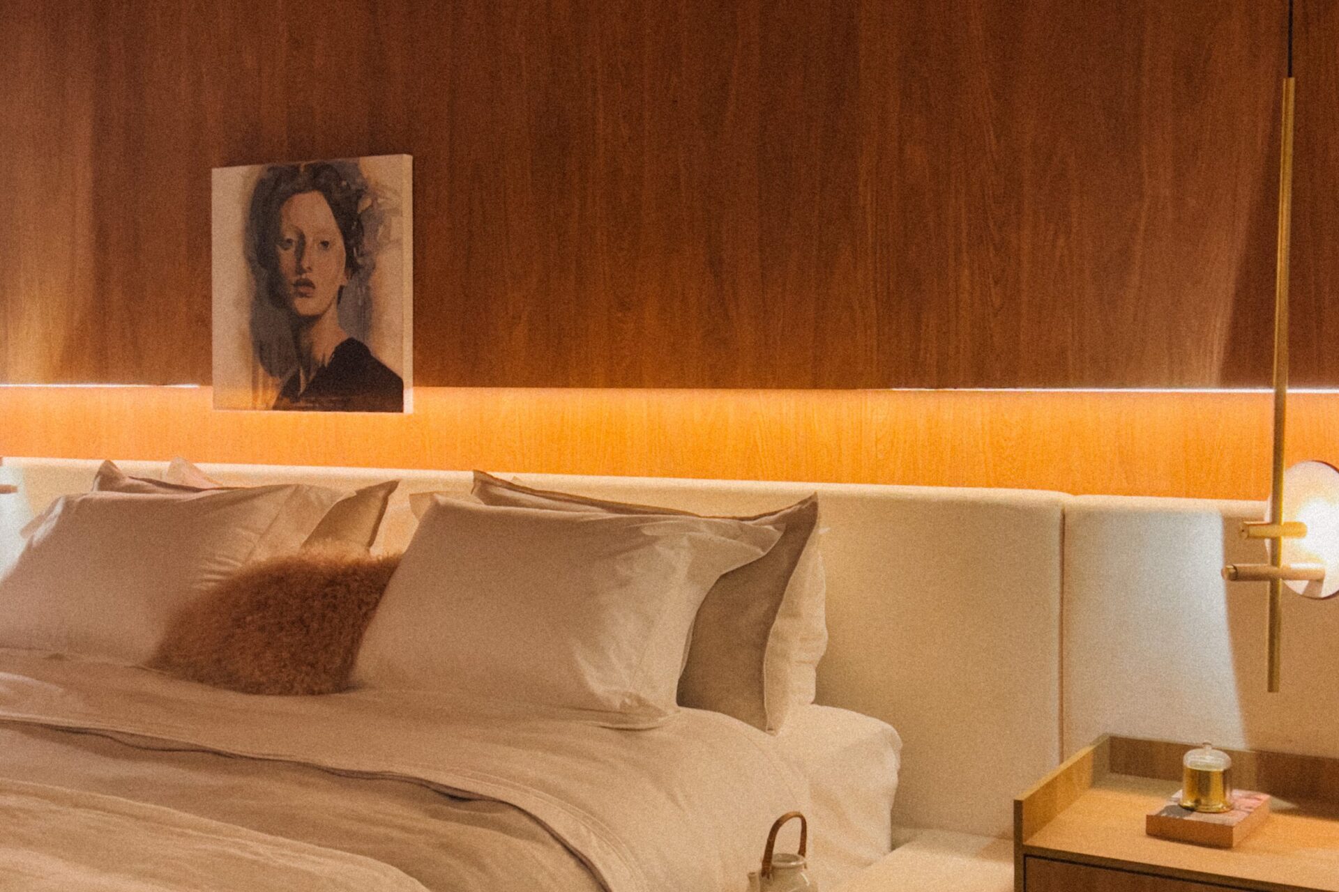 Cozy queen-size bedroom with a painting.