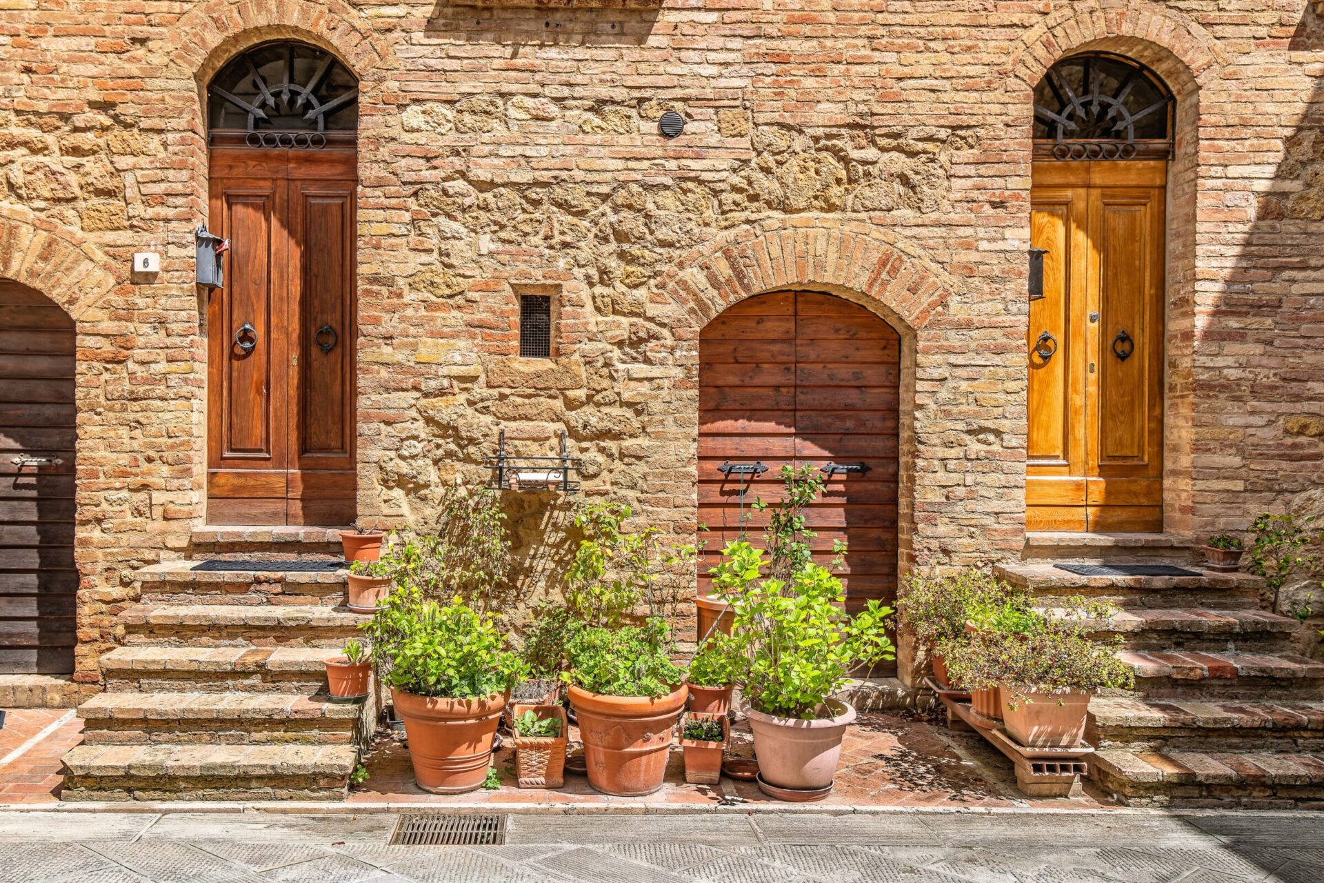 Facade and wooden doors of brick houses