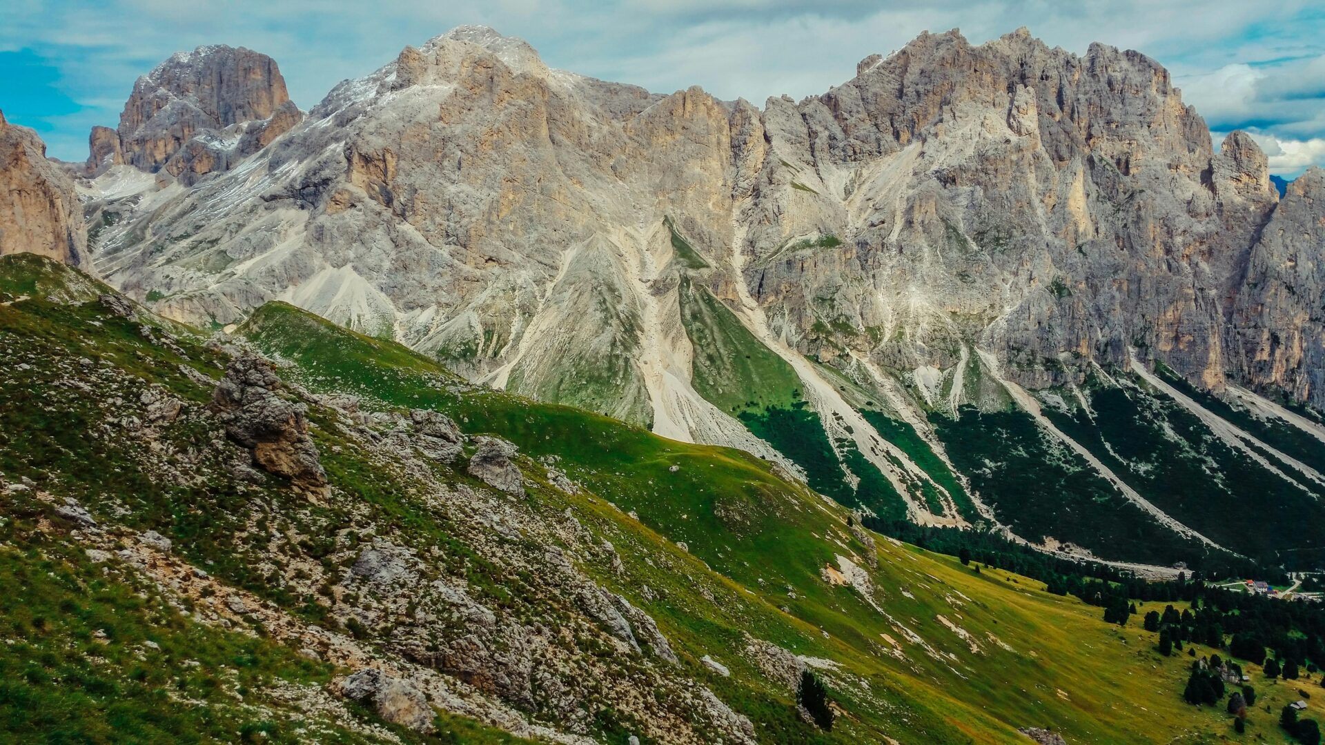 Rocky mountains in the Dolomites, Italy. Mountain peaks, green landscape, hiking trail, outdoor scenery.