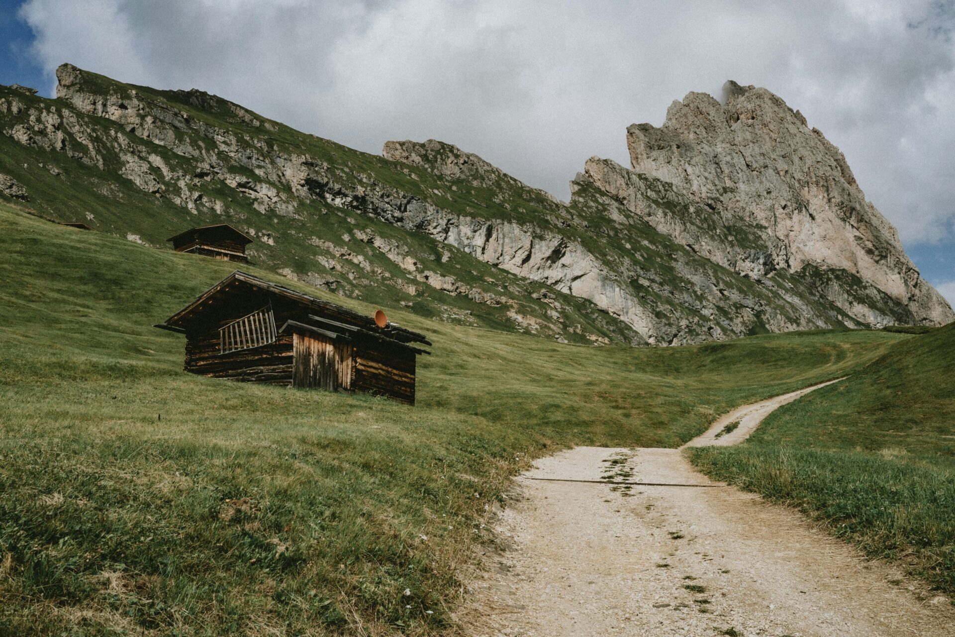 Bike trail in Seceda, Ortisei, BZ, Italia. A cottage or cabin on a hill in Ortisei Italy.
