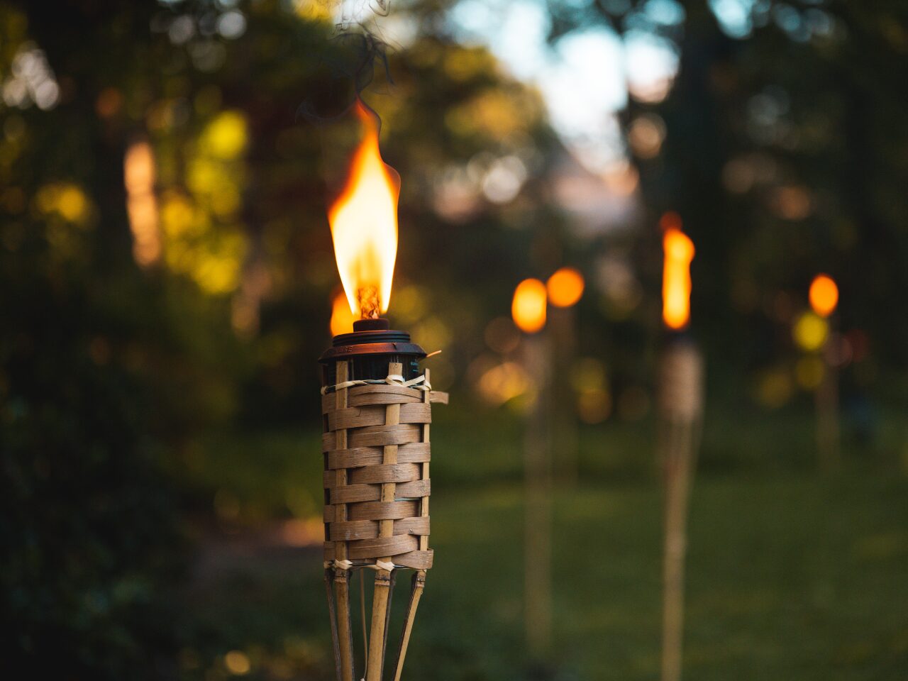 A Lighted Torch on Wooden Stand