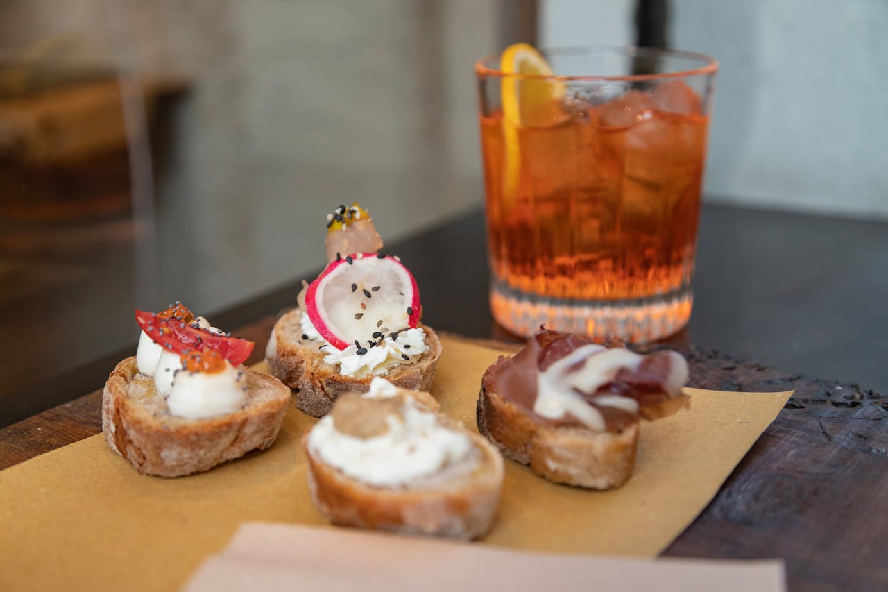 A tray with bread, cheese and a drink - food served in Tuscany