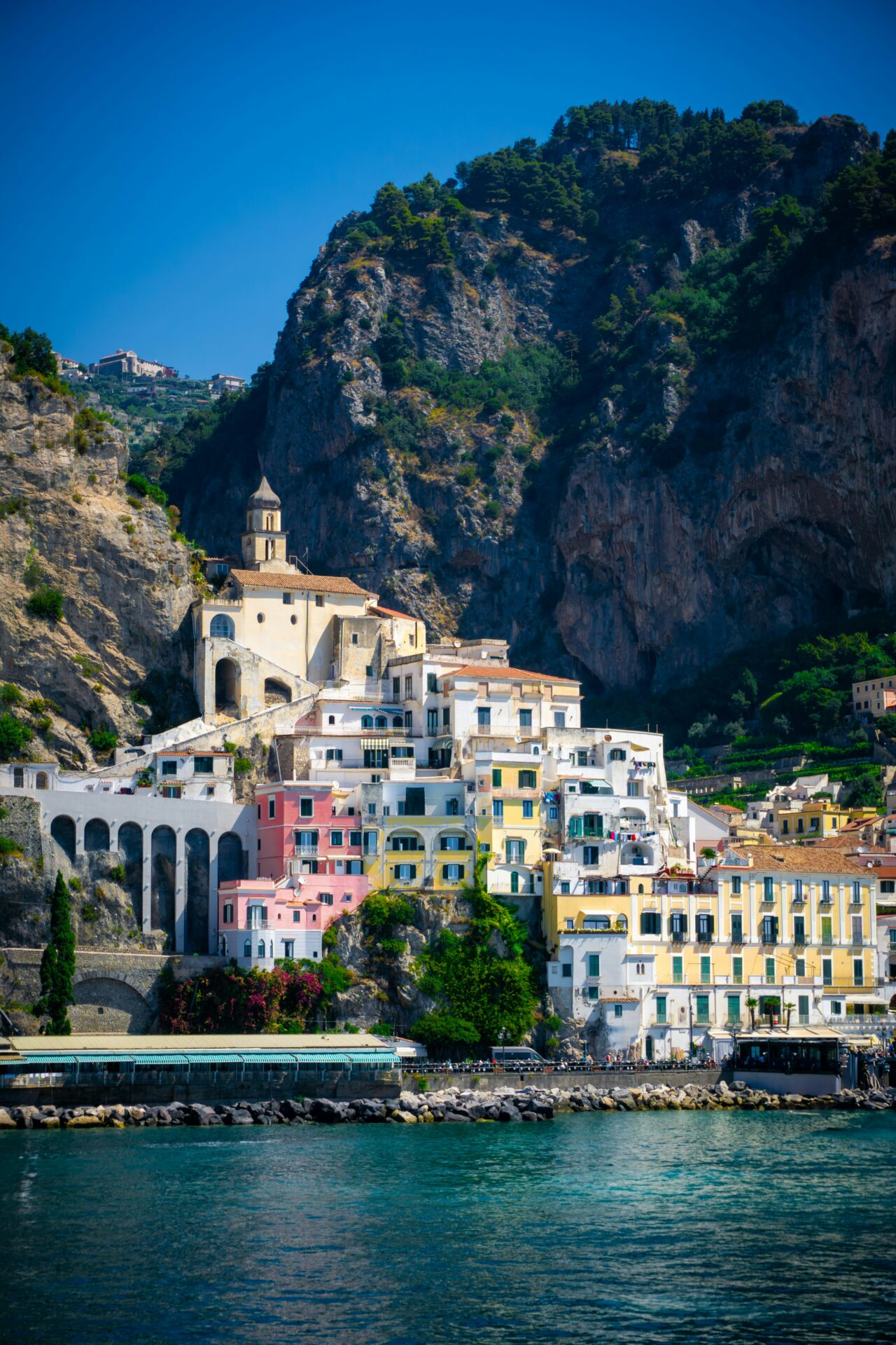 A breathtaking photo of a colorful village nestled on the cliffs of the Amalfi Coast.