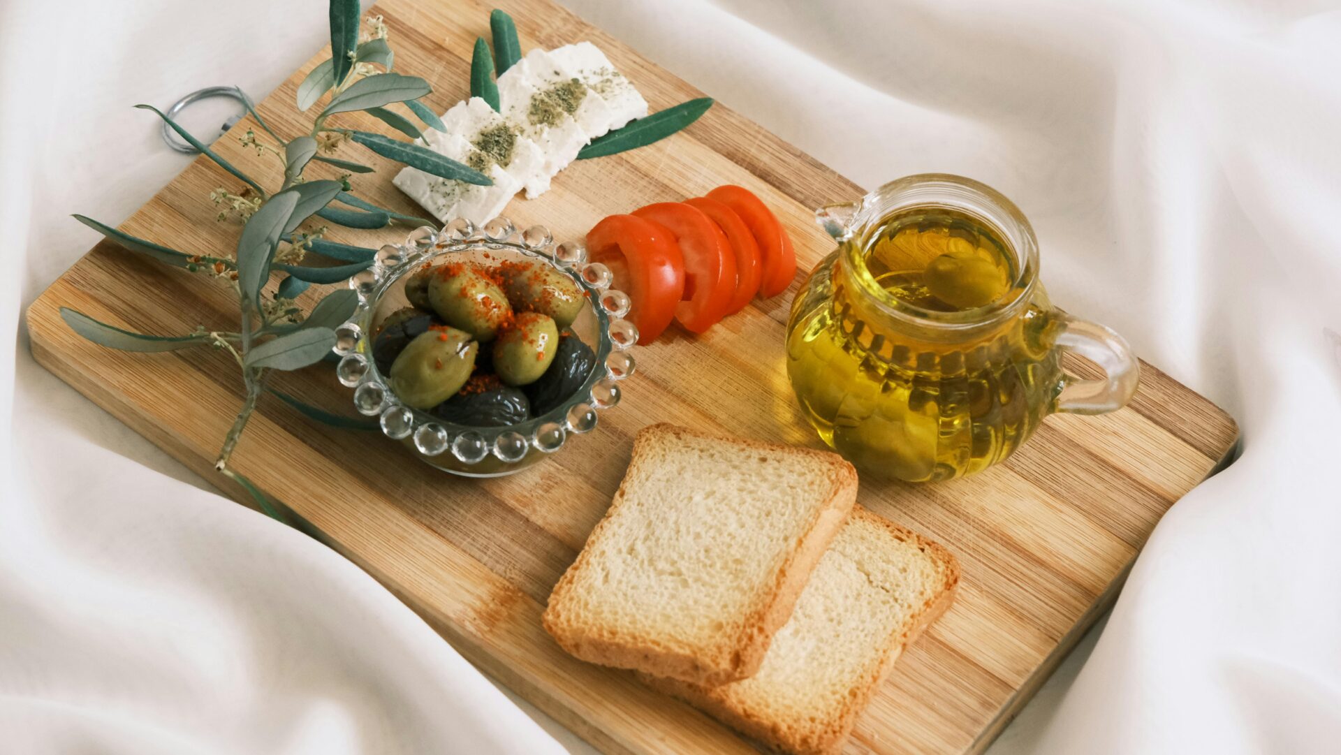 Appetizers or bread and Olive Oil on Cutting Board