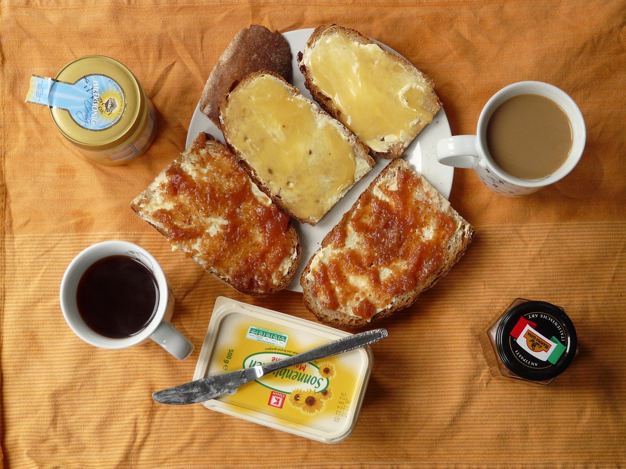 Breakfast meal - coffee, honey bread, and jam