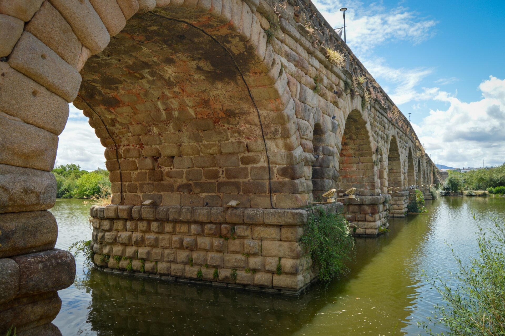 Bridge ruins or aqueduct in Rome - river with bridge