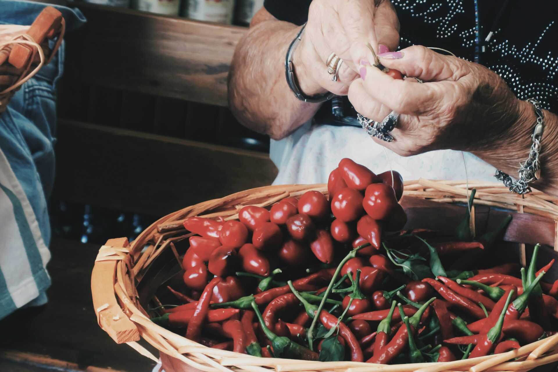 A bunch of vibrant red Calabrian chili peppers tied together