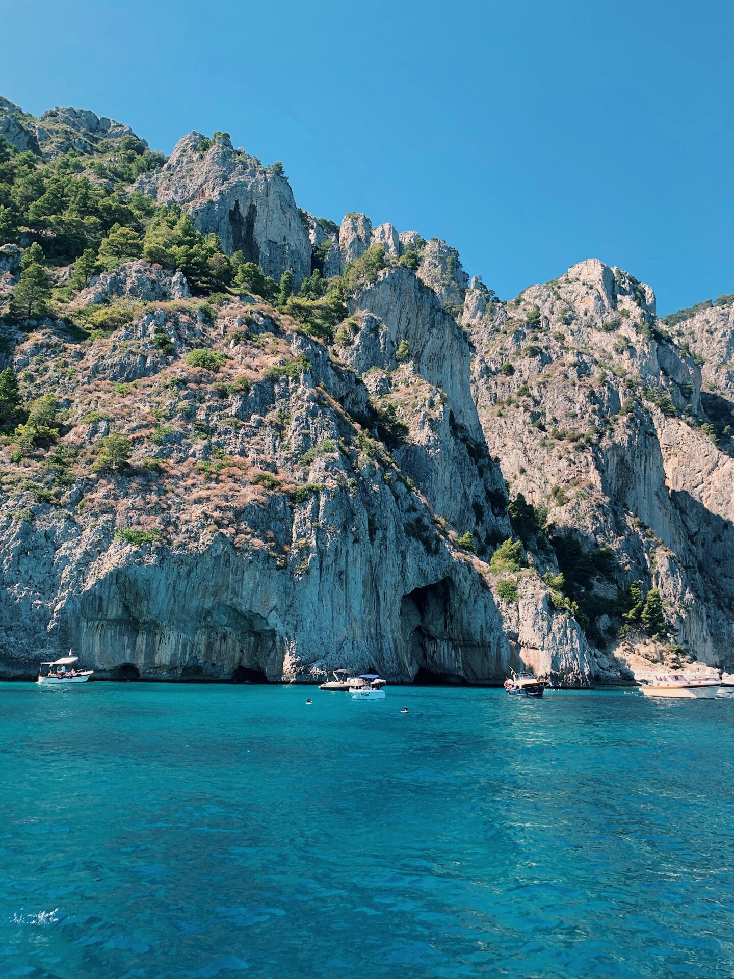 Glowing blue water outside the Blue Grotto of Capri