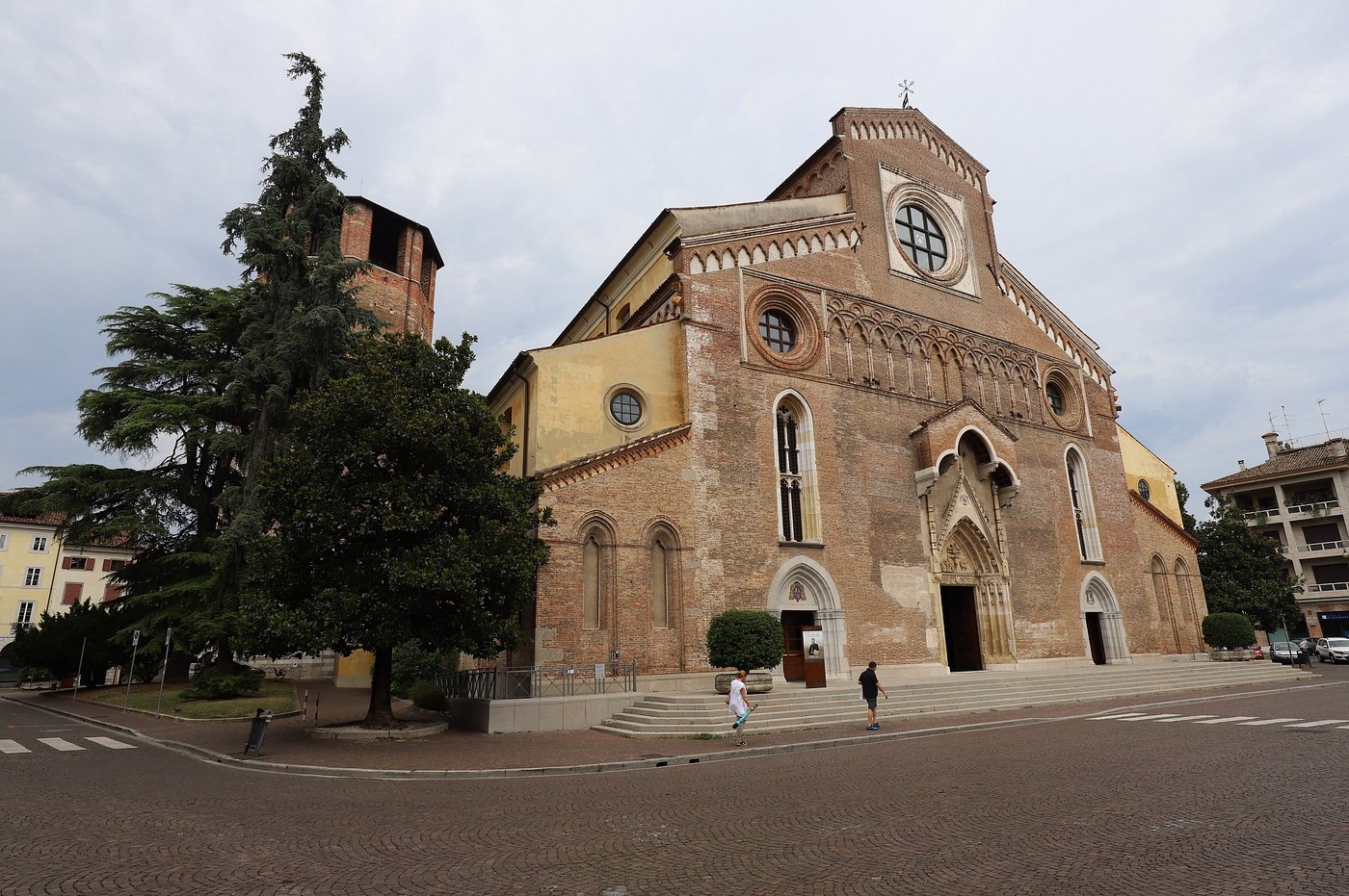 In front of Cathedral of Udine in Italy.