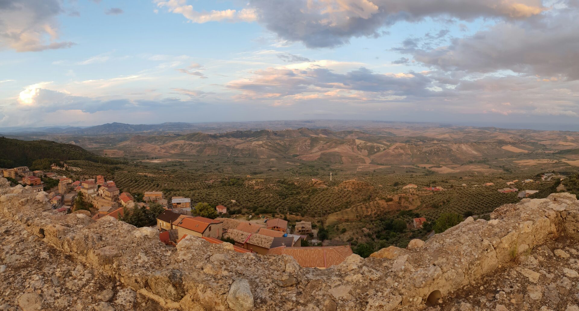 Charming Calabrian mountain village with narrow stone streets and traditional stone houses.