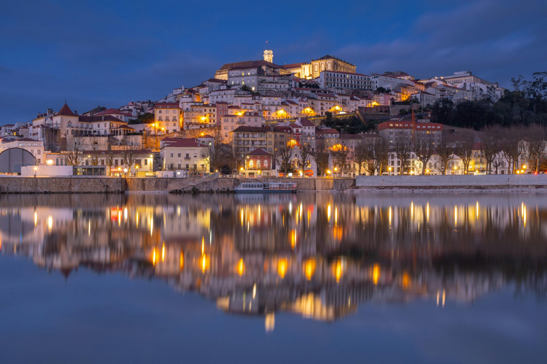 Coimbra, Portugal at night with a reflection