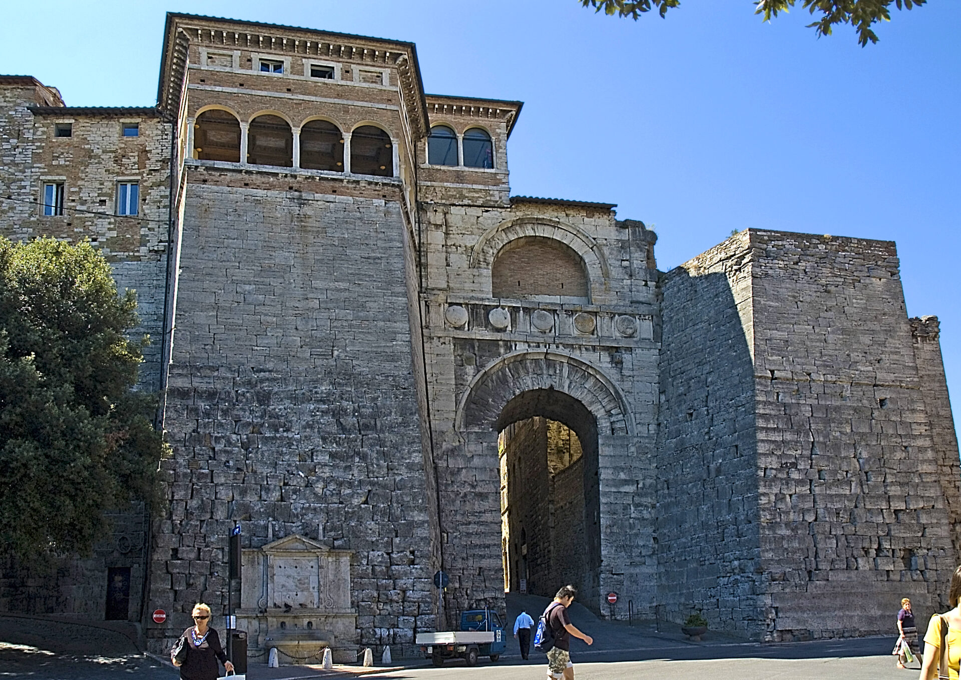 The Etruscan Arch, an ancient stone gateway with impressive arches and inscriptions, standing as a historic entrance to the city of Perugia, Italy.