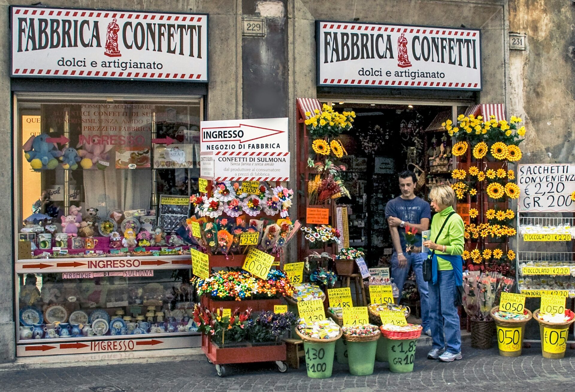 Fabbrica Confetti in Sulmona, Italy, showcasing traditional architecture and vibrant displays of handcrafted sugar-coated almonds, known as confetti.