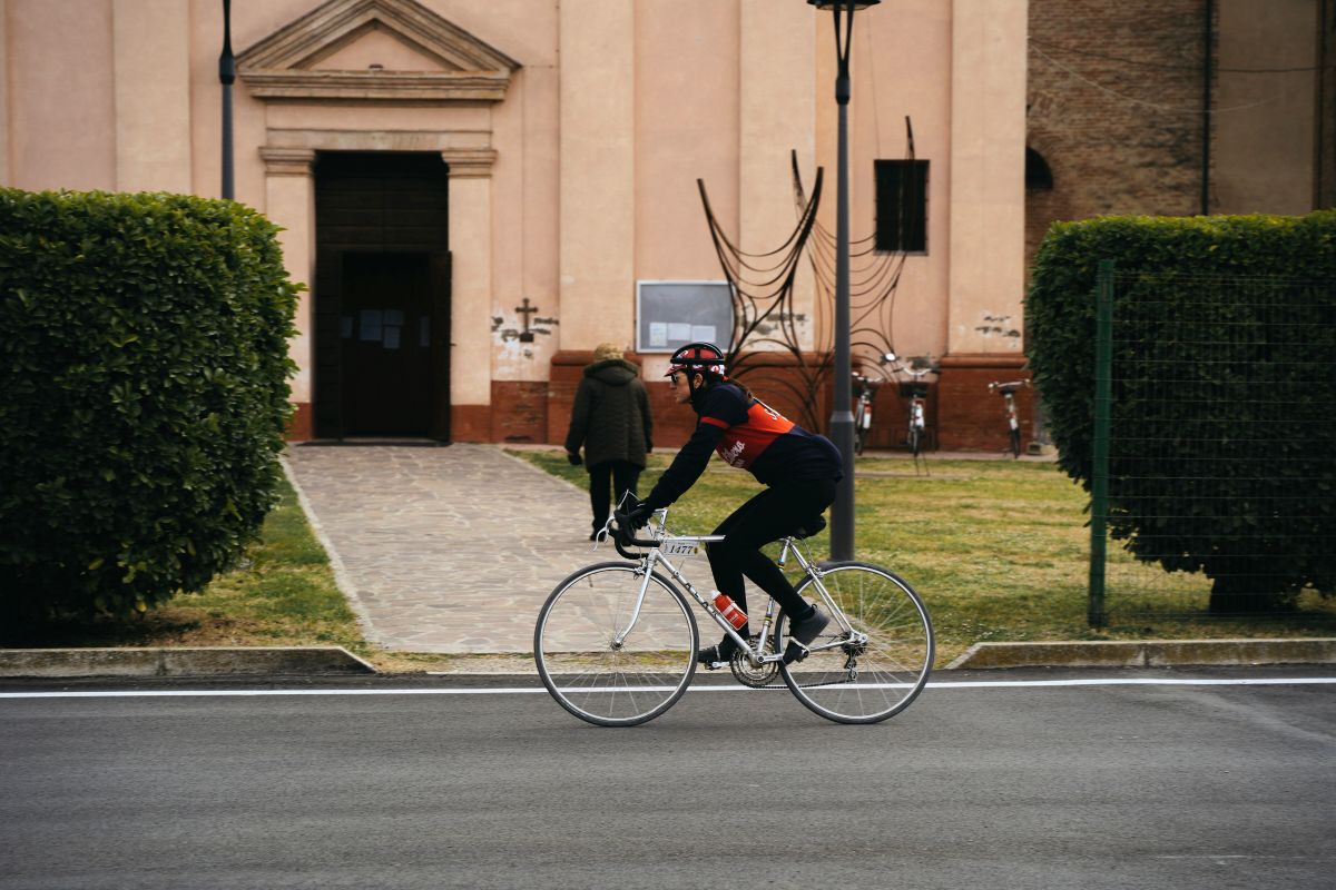 A man cycling in Ferrara, Italy.