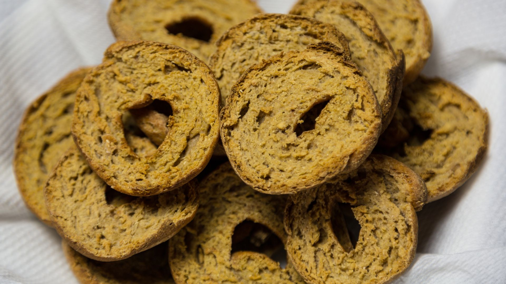 The image shows Frisella, a twice-baked bread from Southern Italy, shaped like a ring or bagel.