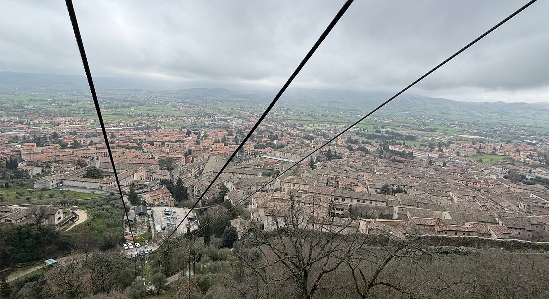 Open-air cable car of Funivia Colle Eletto ascending Mount Ingino above Gubbio, Umbria.