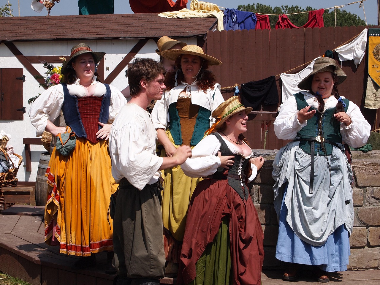 Group of people wearing Renaissance or medieval traditional costumes - European dress