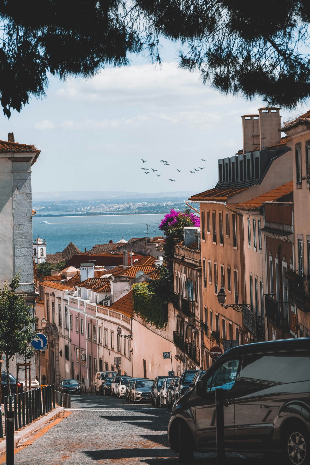 Street with cars parking on the side in Lisbon, Potugal