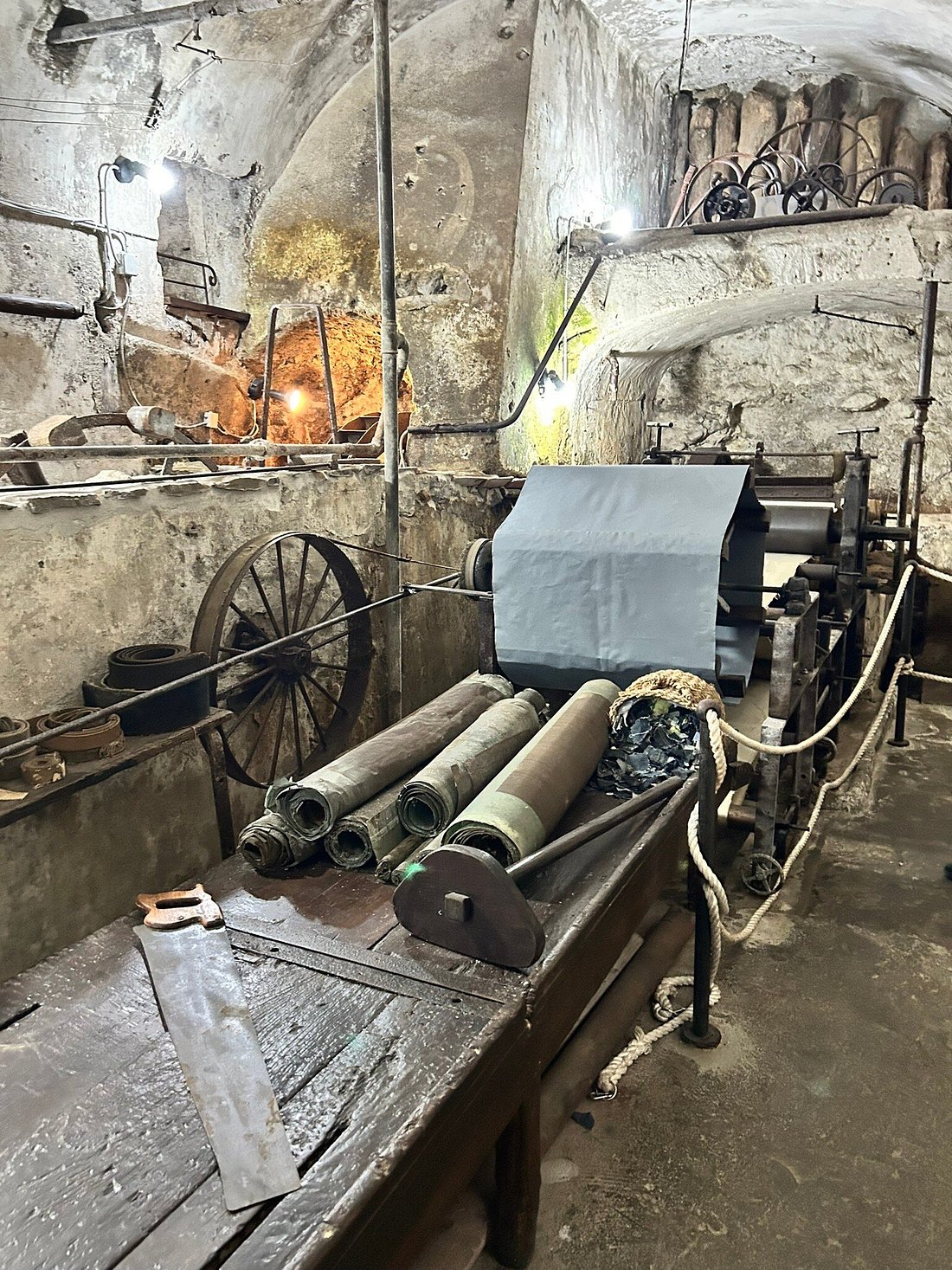 Historic paper-making machinery and tools on display at Museo della Carta in Amalfi, Italy.