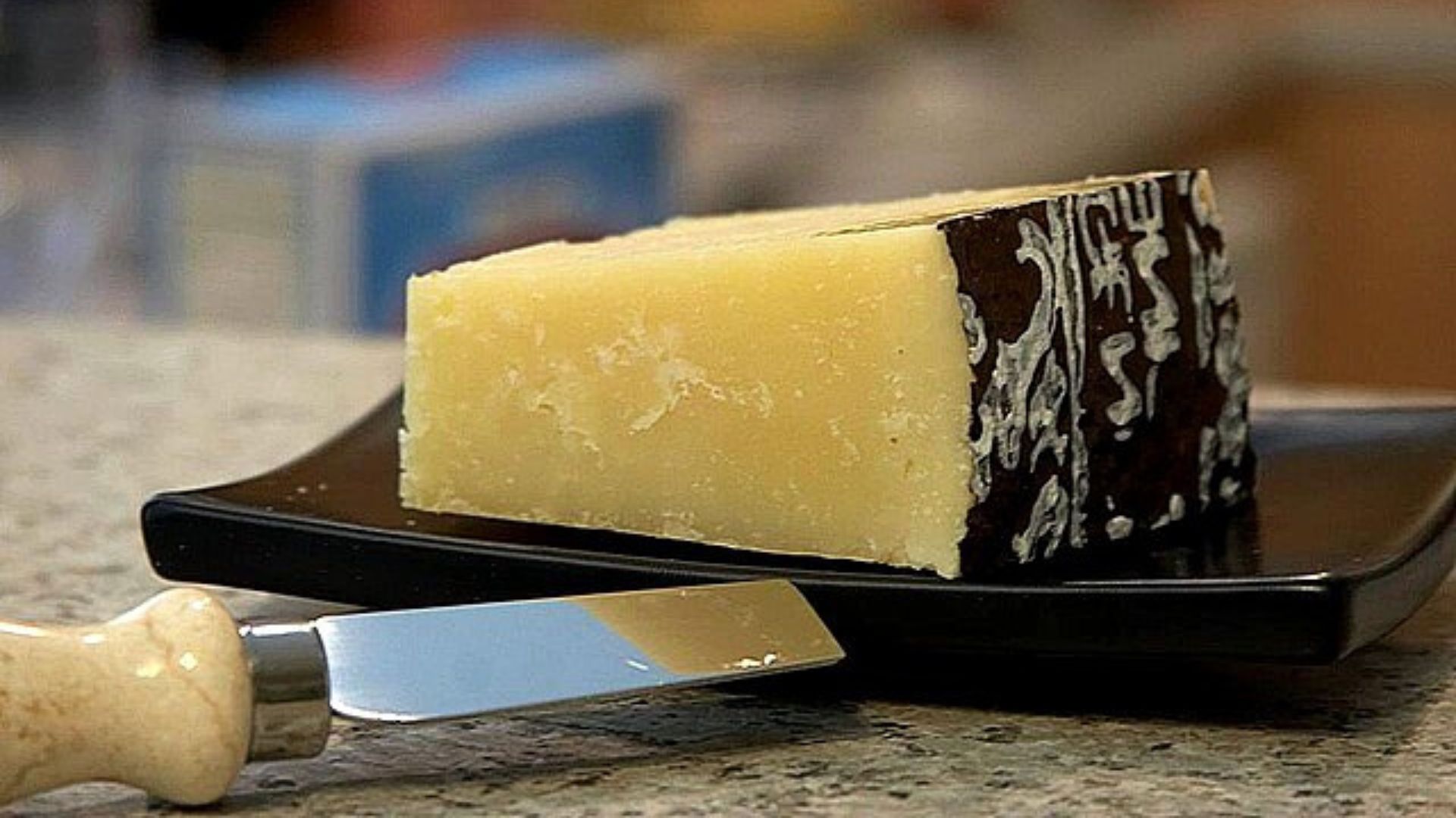 Image shows a slice of Pecorino cheese