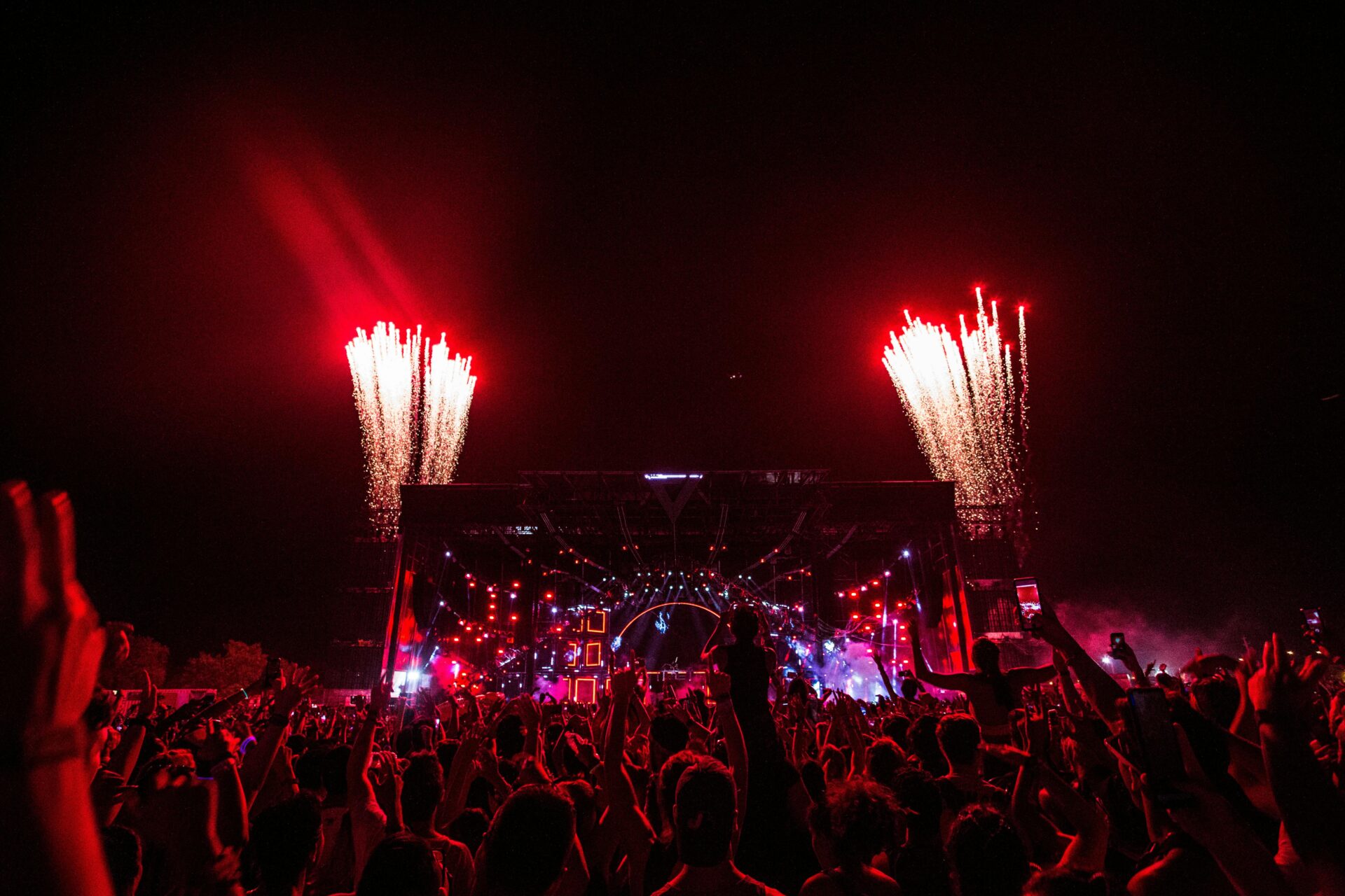People Gathering Near Stage With Fireworks - night outdoor concert