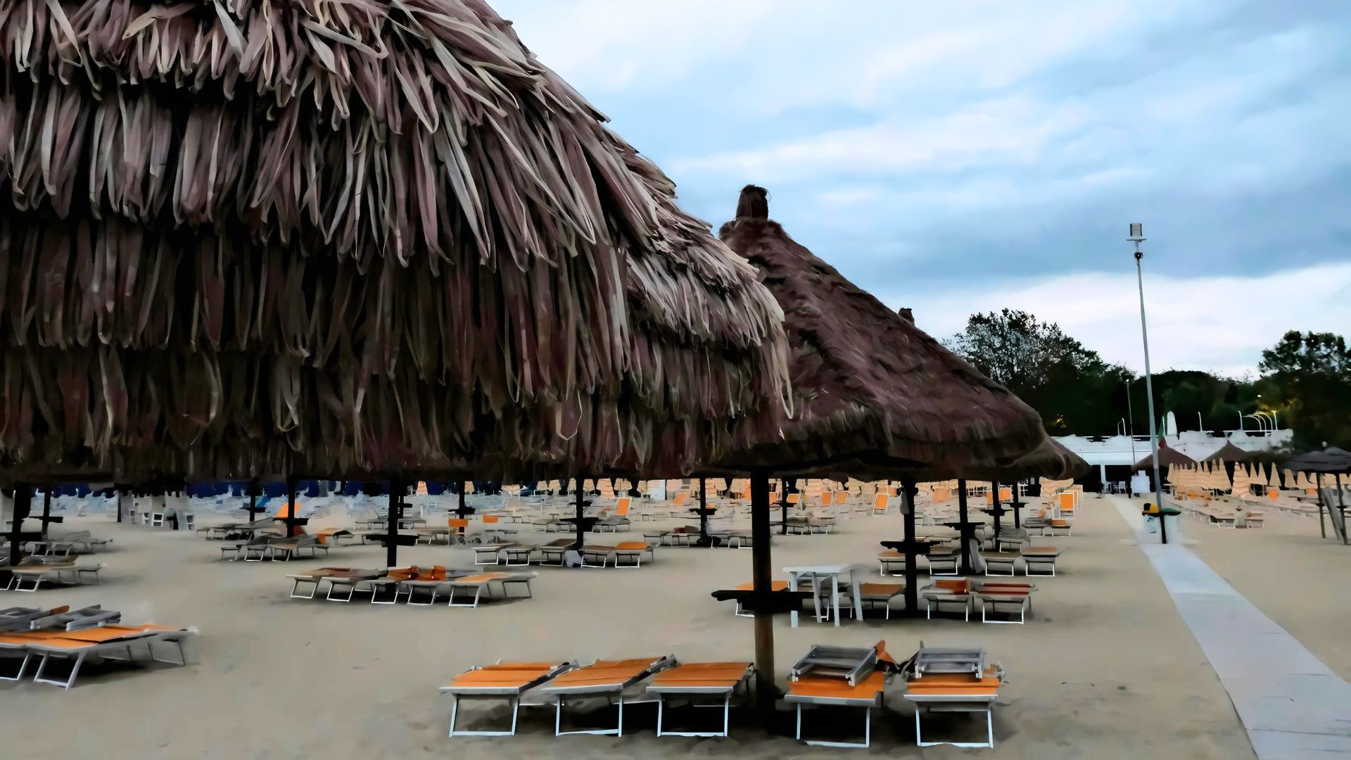 Image of some huts and chairs on a beach in Pescara, Pescara, Italy.