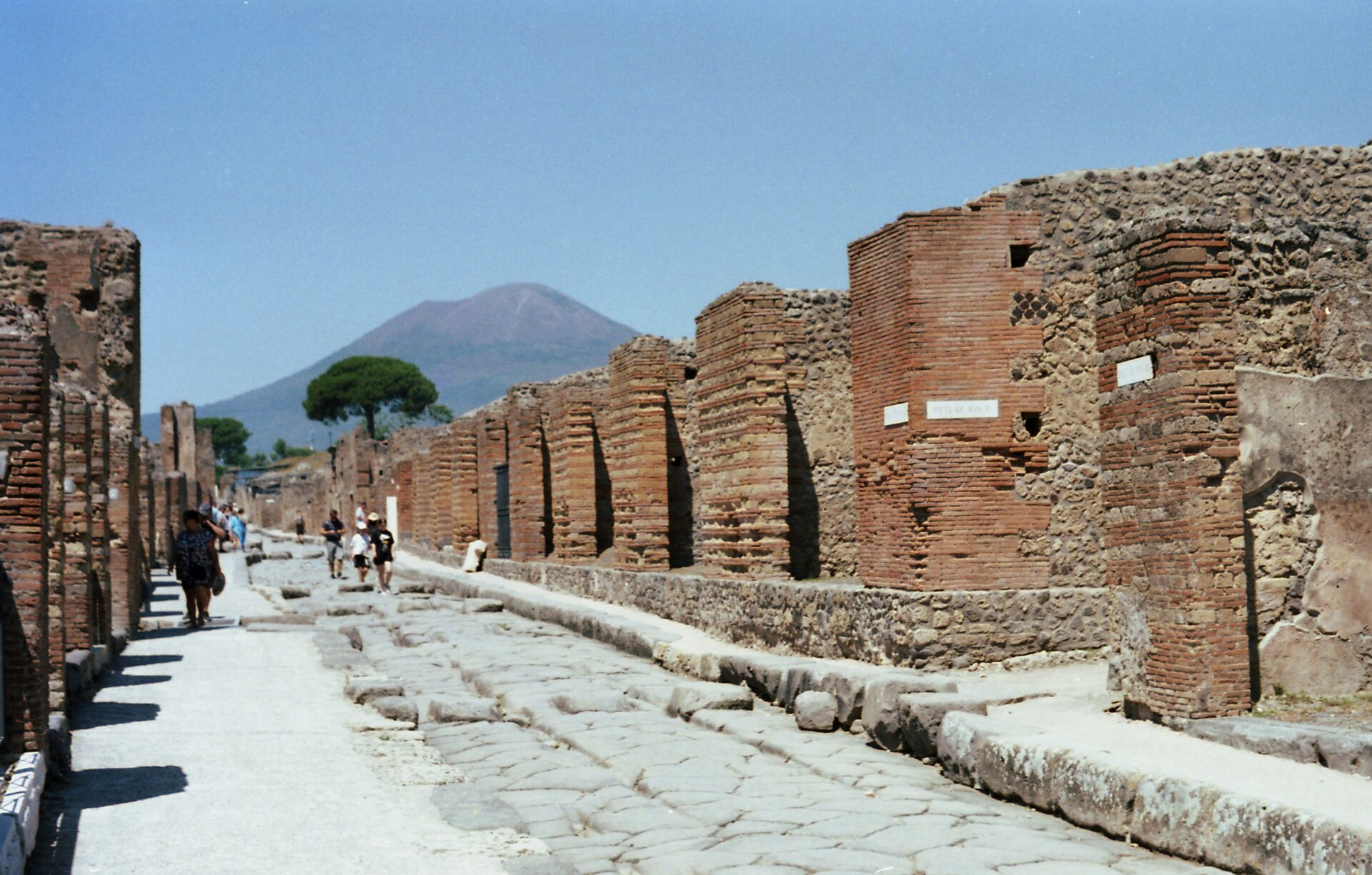Tourist walking through the ancient ruins of Pompeii