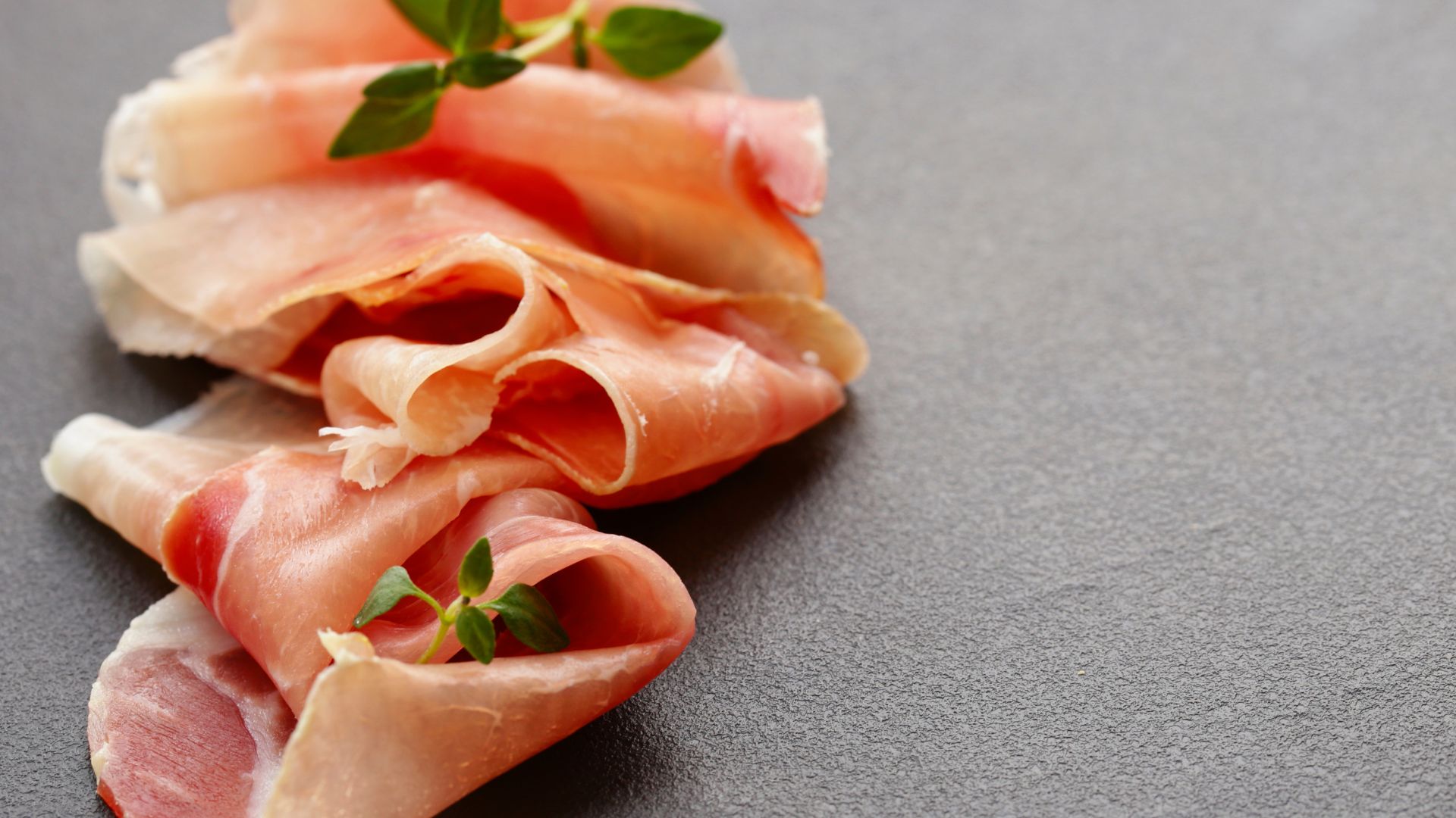 Image shows thinly sliced  Prosciutto di Parma