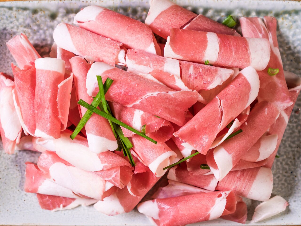 Prosciutto slices on a plate
