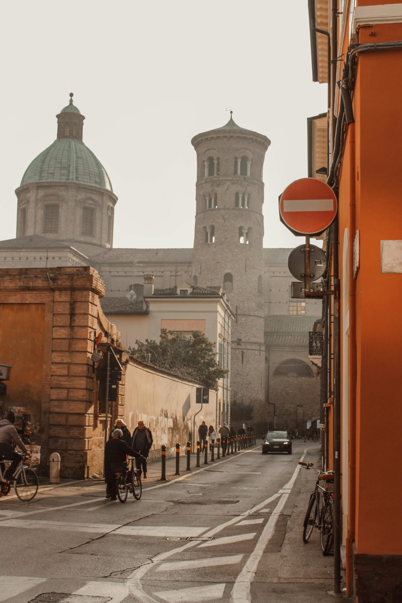 harming street in Ravenna lined with historic buildings and pedestrians strolling