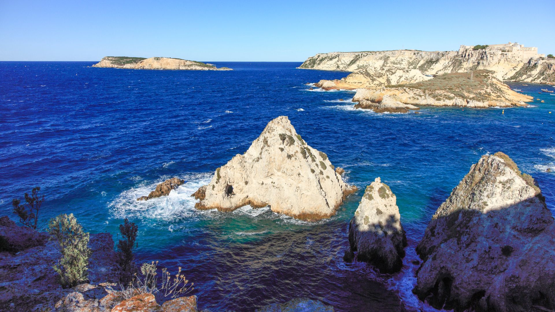 The image is of San Domino, which is the largest and most popular island in the Tremiti archipelago, located in the Adriatic Sea off the coast of Apulia, Italy.