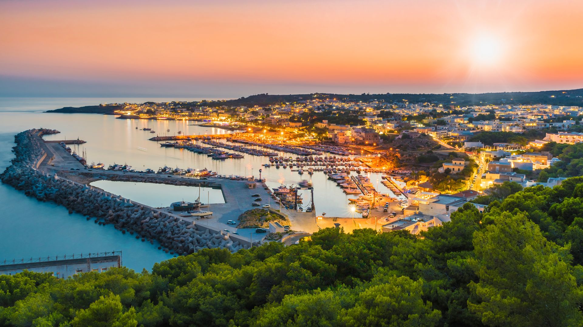 Image shows sunset at Santa Maria di Leuca, Italy