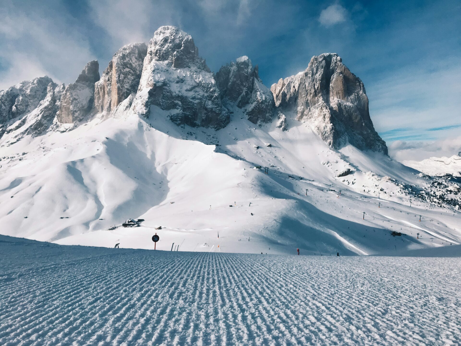 Snow landscape and rocky mountain (Sassolungo, Italy)