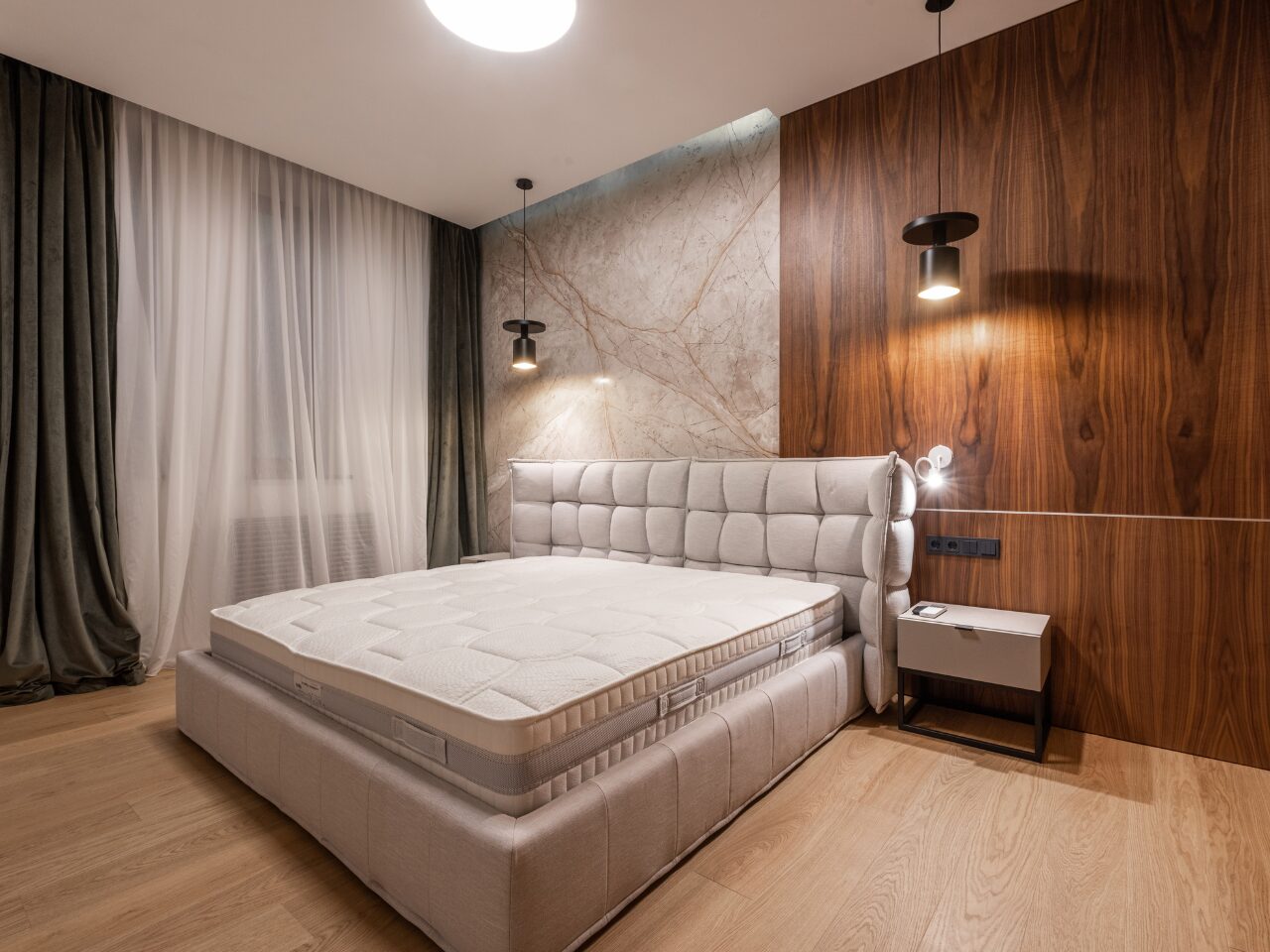 Spacious hotel bedroom with queen size bed