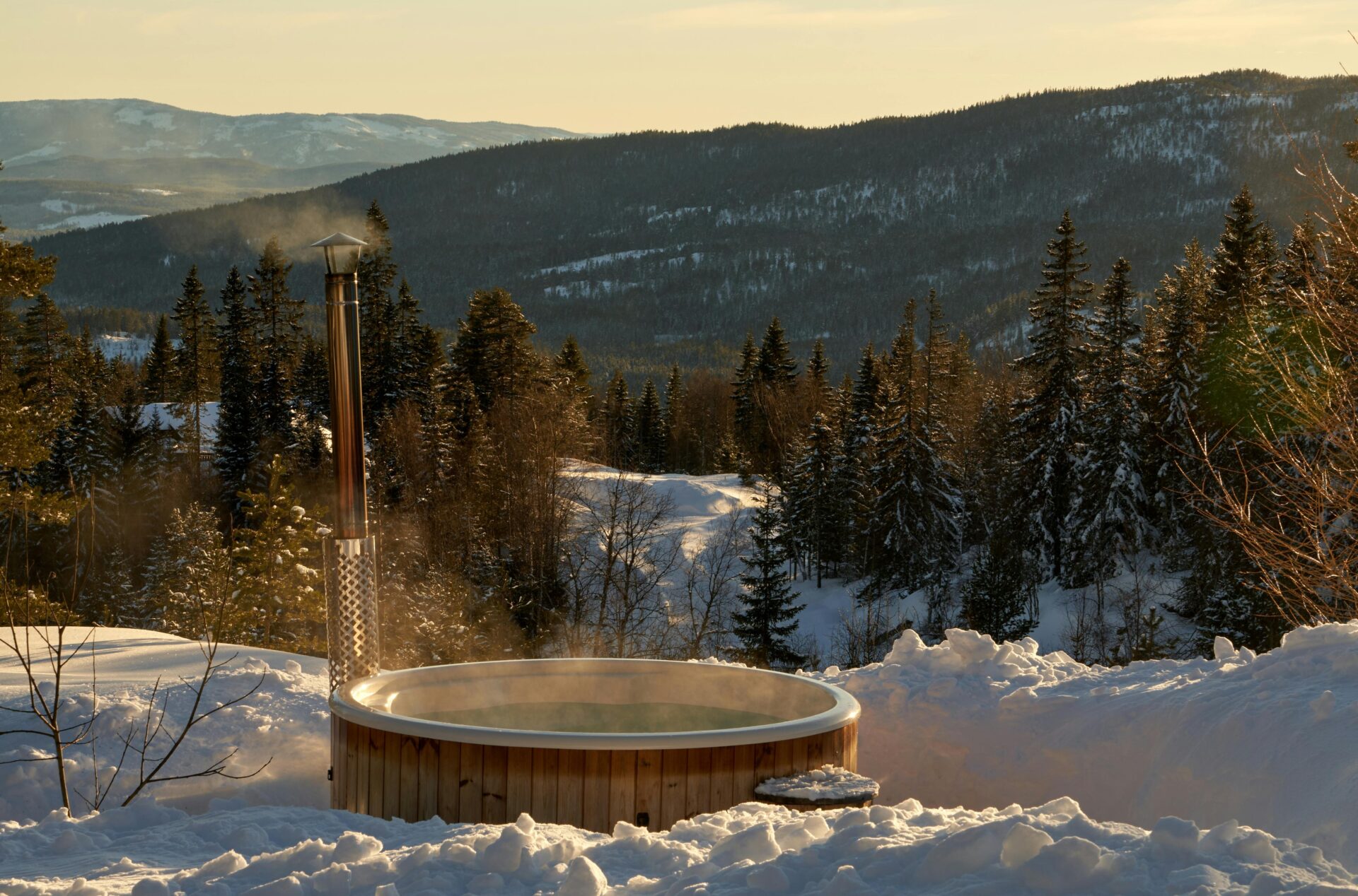 Jacuzzi or hot tub during winter with a mountain view