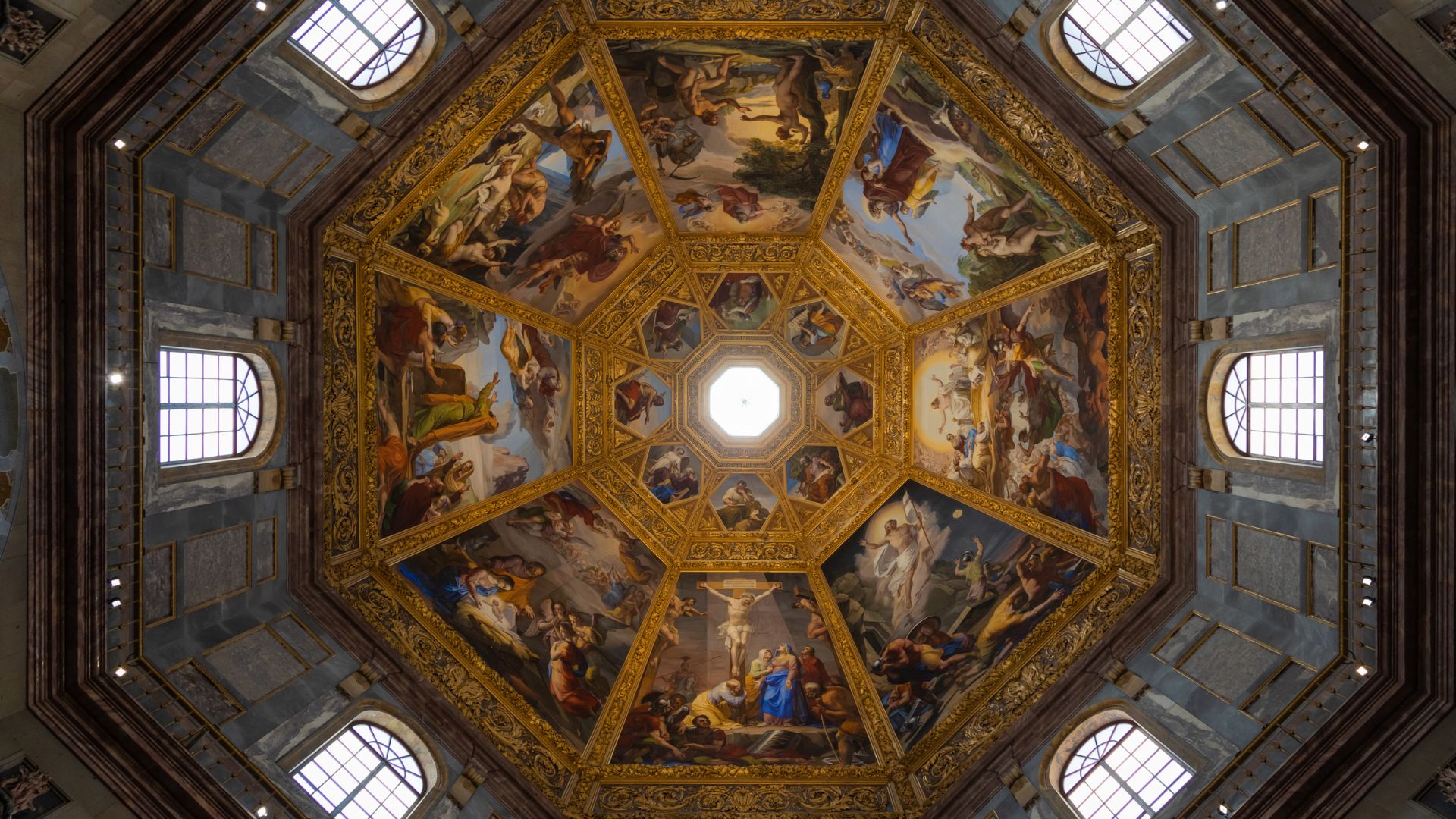 The image depicts the frescoed dome of the Chapel of the Princes in the Medici Chapels, located in Florence, Italy