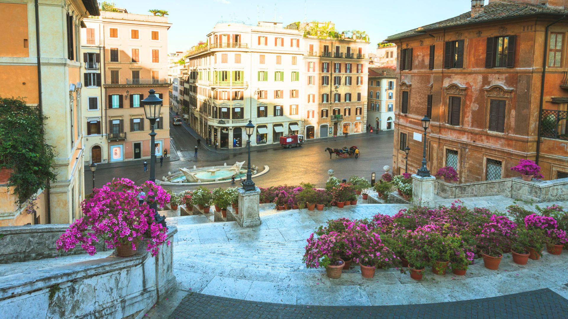 Image shows colorful flowers on The Spanish Steps in Rome