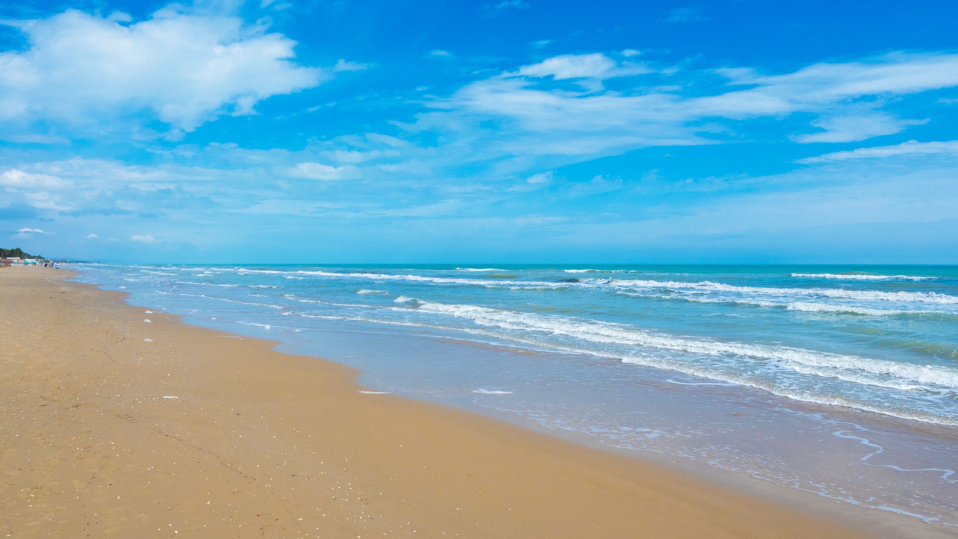 The image is Spiaggia di Pineto, located on the Trabocchi Coast in Abruzzo, Italy. Spiaggia di Pineto is known for its golden sand, clear waters.