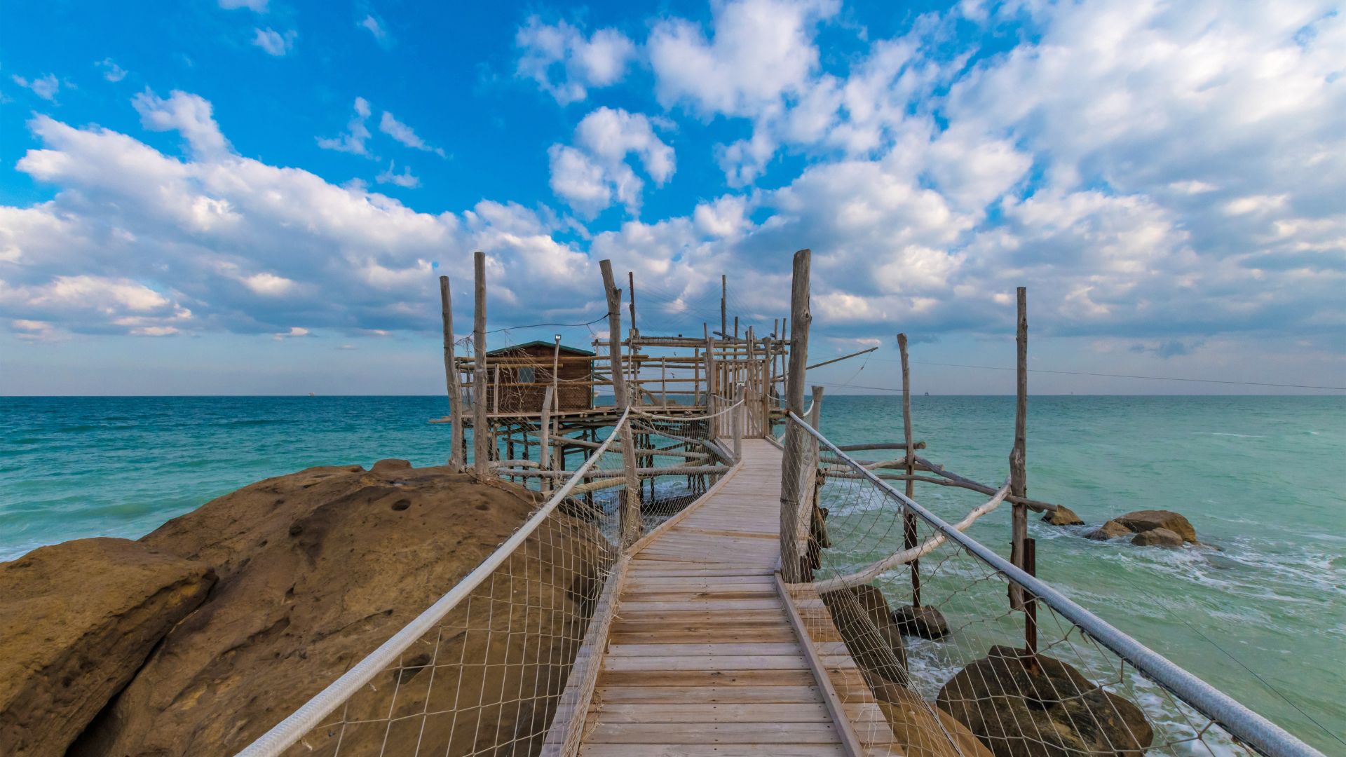 The image shows a fishing platform at The Trabocchi of Abruzzo, Italy