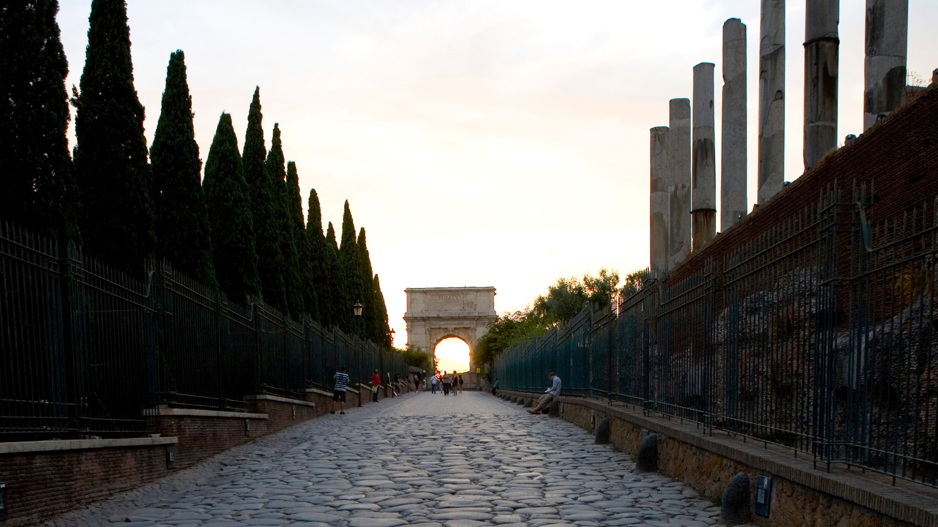Image shows The Via Sacra, Rome  with the Arch of Titus visible in the distance