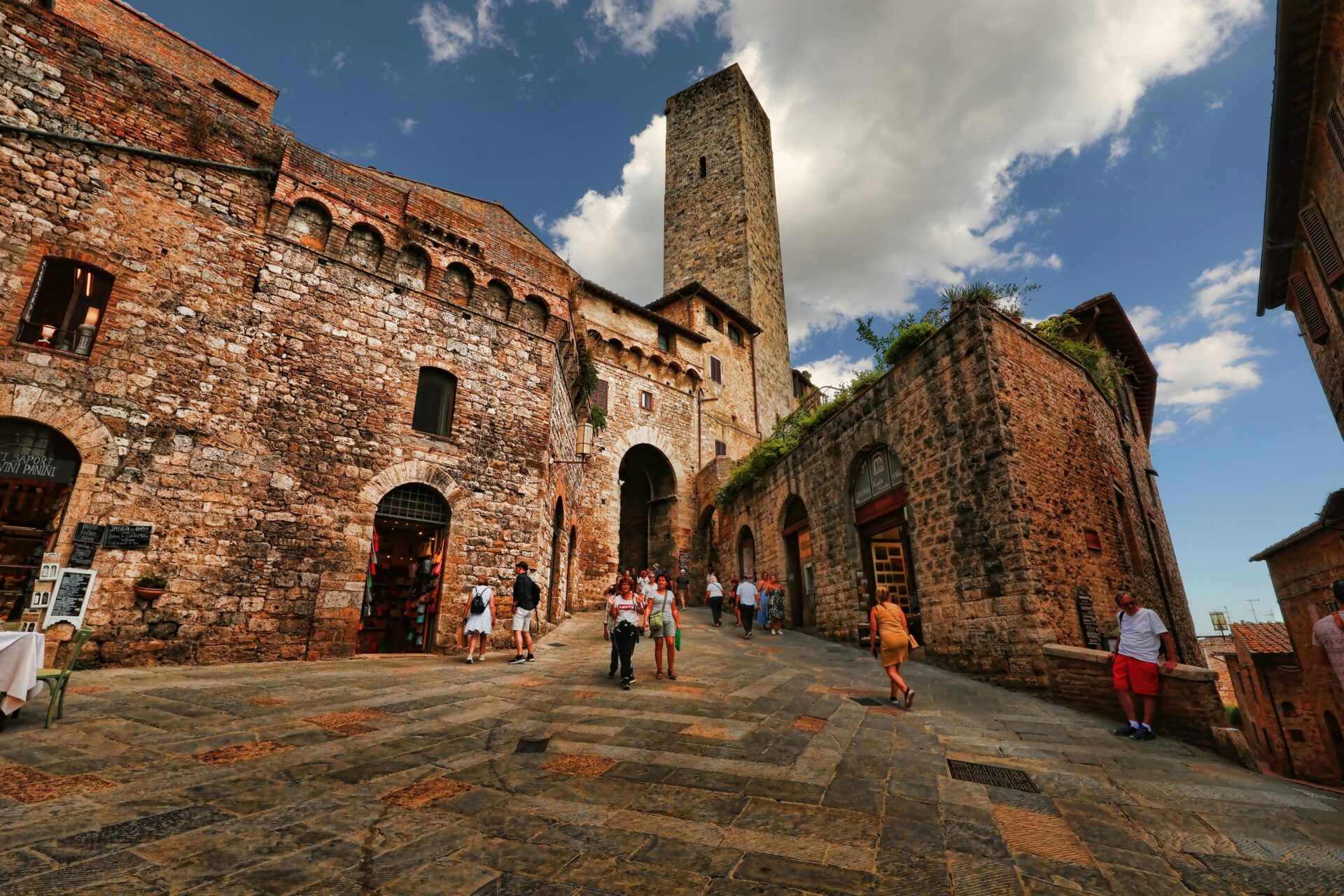 Tourists Walking through San Gimignano in Italy