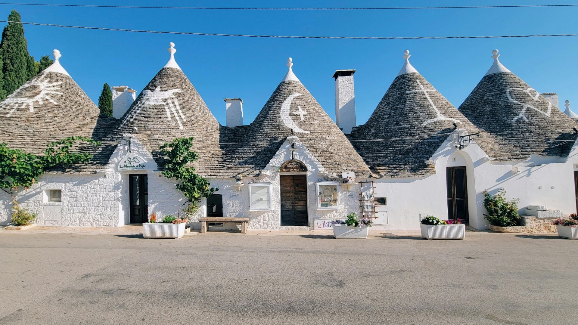 Image shows Trulli in Alberobello, Puglia, Italy.