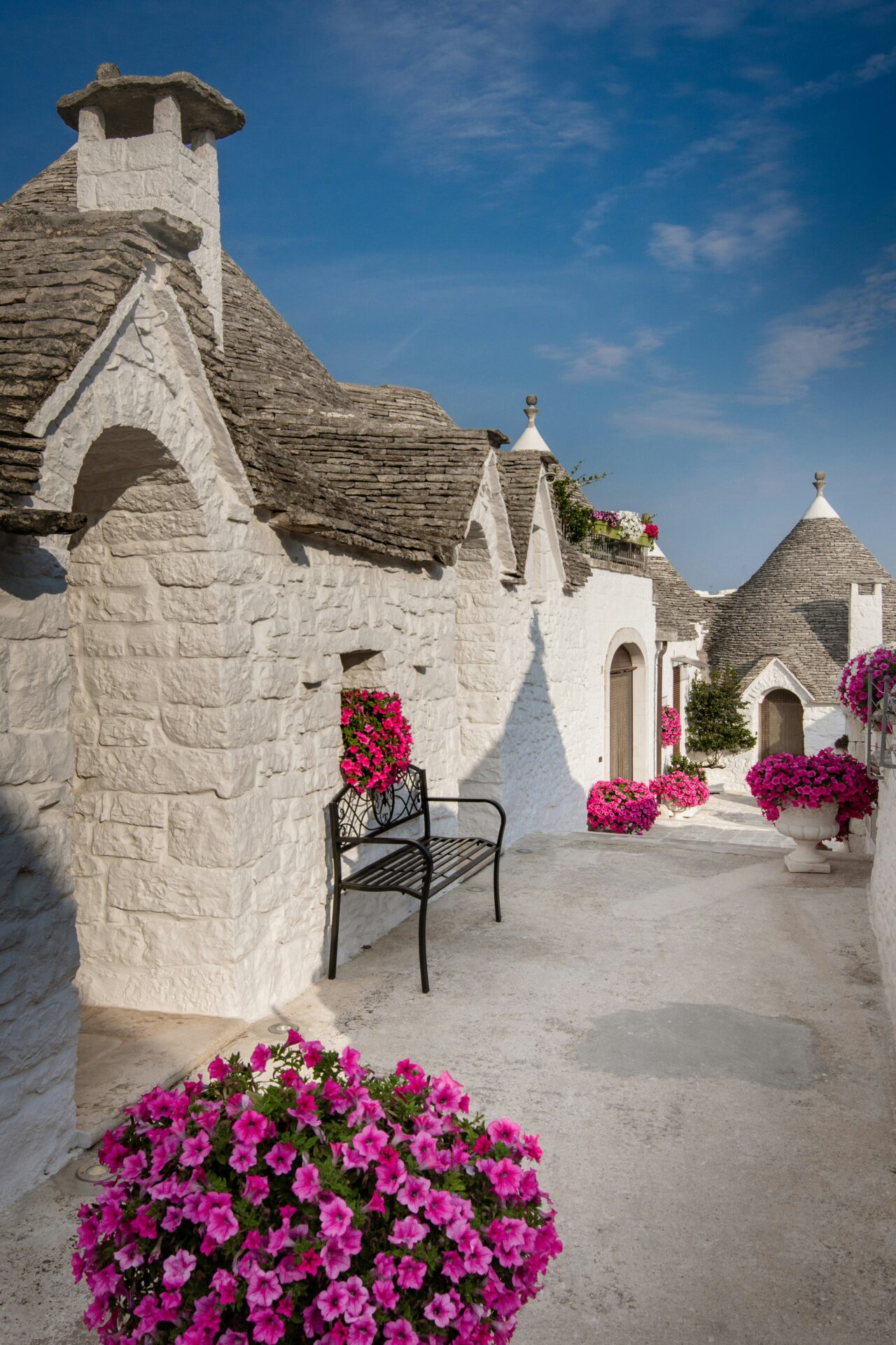 Charming street in Alberobello, Italy, flanked by rows of trulli houses