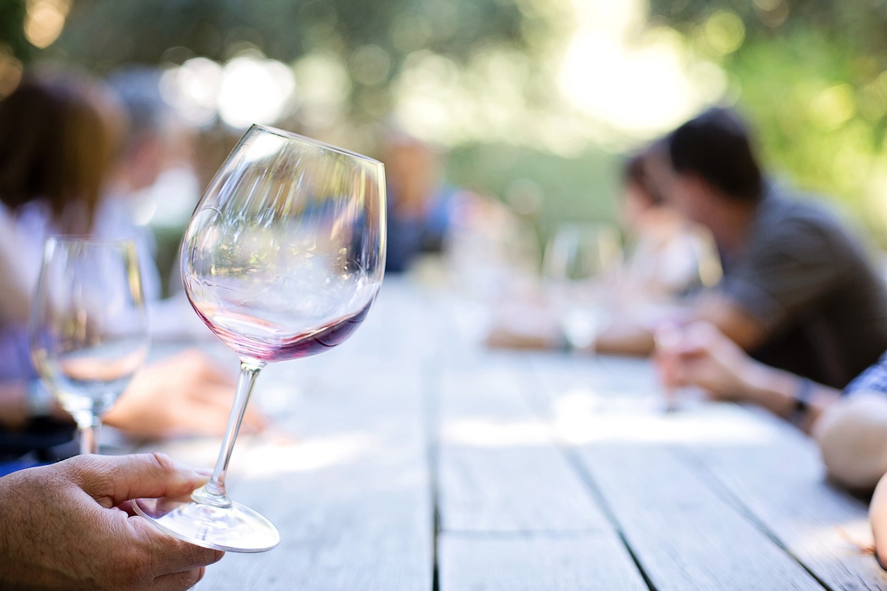 Wineglass with people in the background