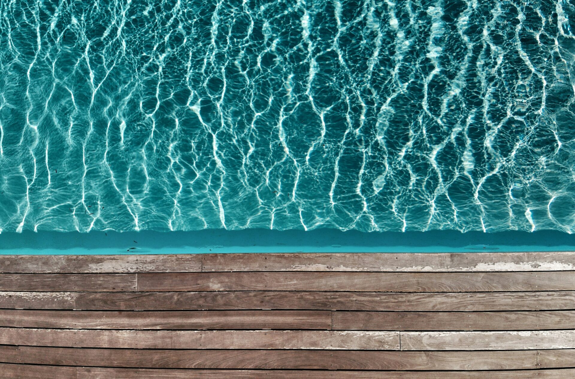 Crystal clear water near a wooden deck