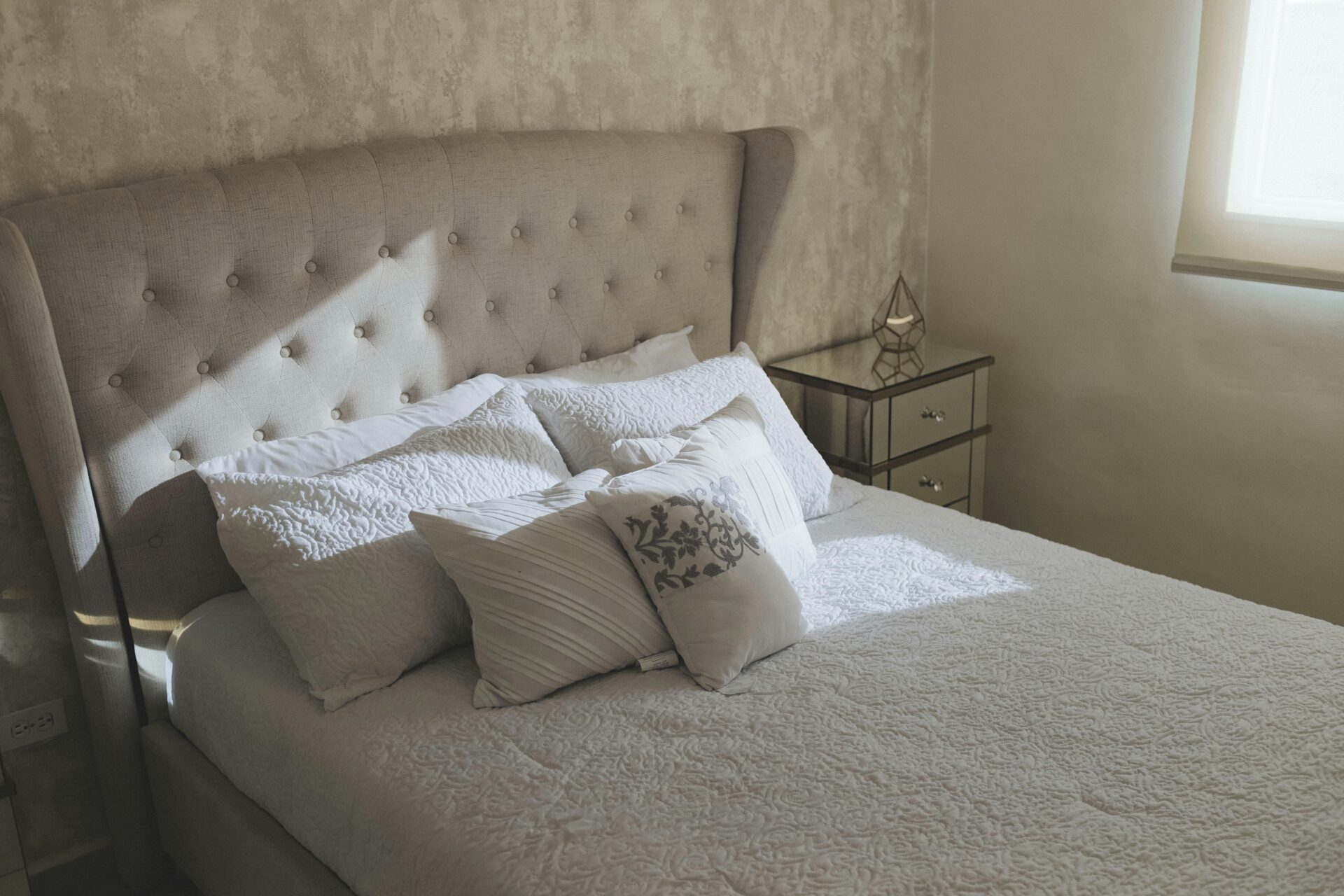 Hotel bedroom with a high headboard