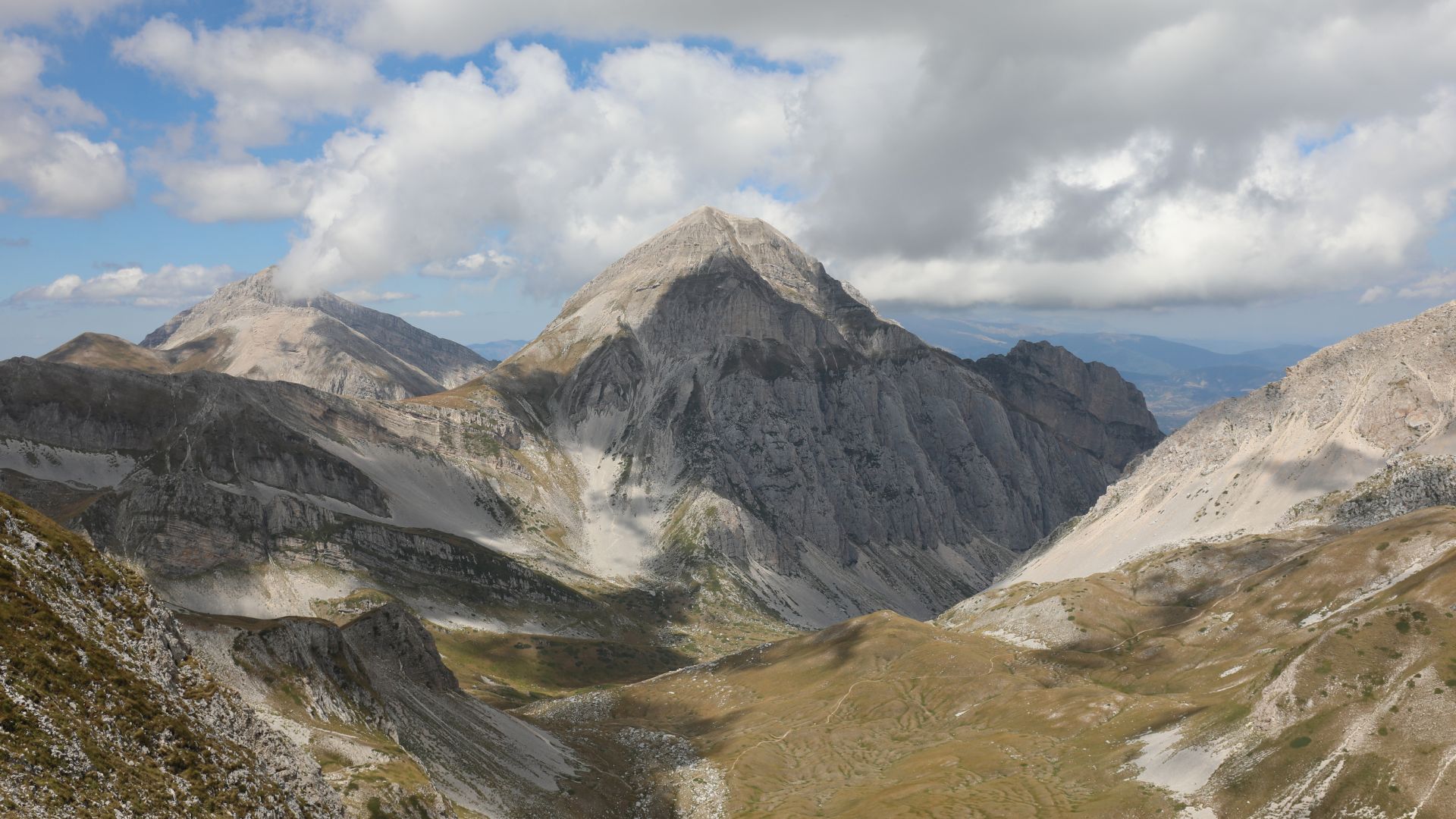 Mountainous landscape with rocky peaks and cloud cover of Abruzzo in Italy.