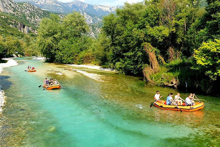 Kayakers paddling along the serene Acheron River